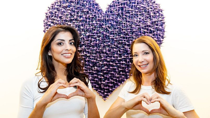 Artist Susana Anaya & Female Entrepreneur & Elizabeth Arthotel Owner Mirjam Alloys in front of 'Infinite Layers of Inclusion' artwork, inspired by IWD