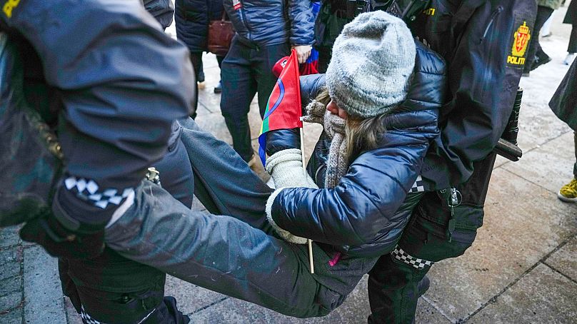 Swedish activist Greta Thunberg is carried away during a protest outside the Norwegian Ministry of Finance, in Oslo, on 1 March 2023.