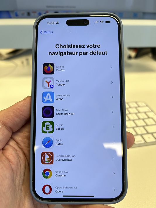A pop-up message to choose a browser is displayed on the screen of an iPhone, in Brussels, Belgium.