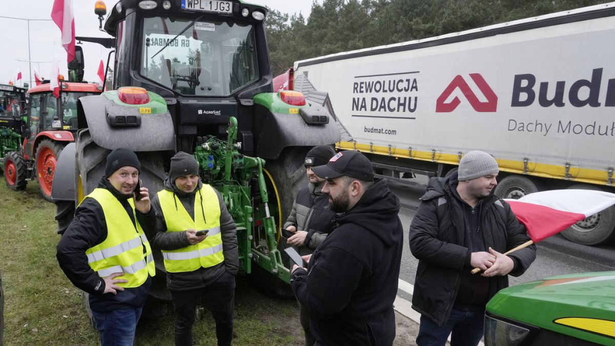 Polish farmers block a major road with tractors during a protest in Lomianki, near Warsaw, Poland, on Wednesday, March 6, 2024. 