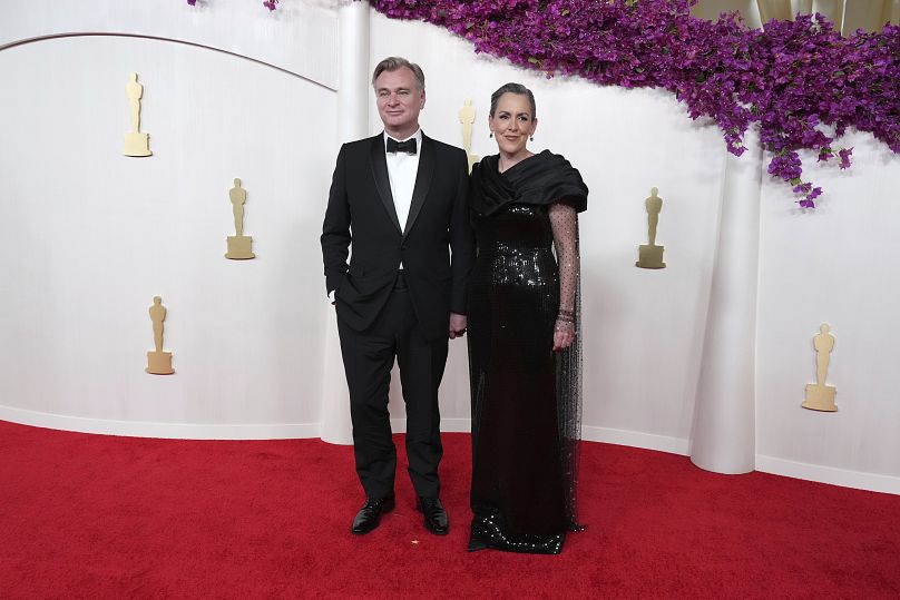 Christopher Nolan, left, and Emma Thomas arrive at the Oscars