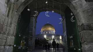 Muslims walk next to the Dome of Rock Mosque at the Al-Aqsa Mosque compound in Jerusalem's Old City, Sunday, 10 March, 2024