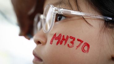A girl has her face painted during a Day of Remembrance for MH370 event in Kuala Lumpur, Malaysia. 