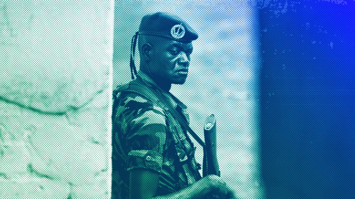 A soldier from the Central African Republic stands guard at a building used for joint meetings between them and US Army special forces, in Obo, April 2012