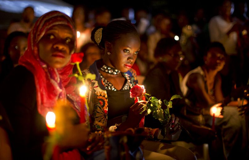 Kenyans listen to the names of each of the victims of the Garissa University attack being read out aloud, during a vigil at Uhuru Park in Nairobi, April 2015