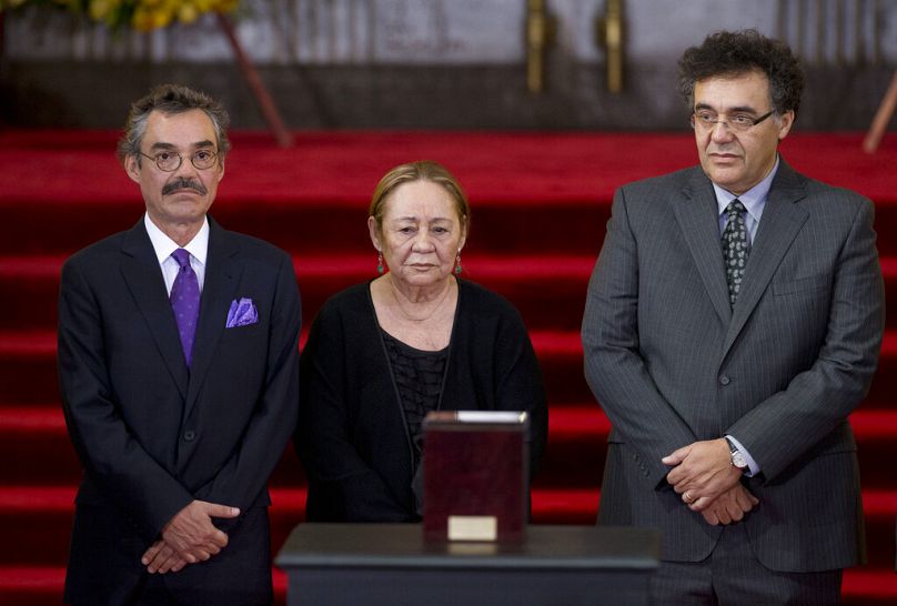 Mercedes Barcha, center, widow of Colombian Nobel Literature laureate Gabriel Garcia Marquez is accompanied by her sons Gonzalo, left, and Rodrigo, right