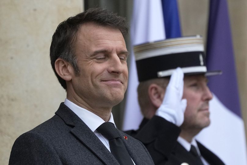 French President Emmanuel Macron waits on the steps of the Elysee Palace, March 2024