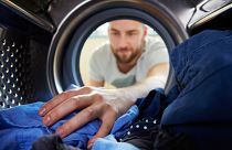 Using less laundry detergent could save your clothes - and the environment.