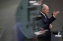 German Chancellor Olaf Scholz answers questions from lawmakers at the Bundestag in Berlin.