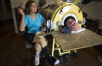 In this Friday, April 27, 2018 photo, attorney Paul Alexander looks out from inside his iron lung at his home in Dallas.