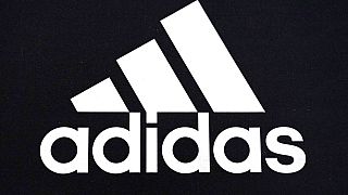 An Adidas logo is displayed on a shoe box in Vernon Hills, Ill., Tuesday, Oct 25, 2022. 