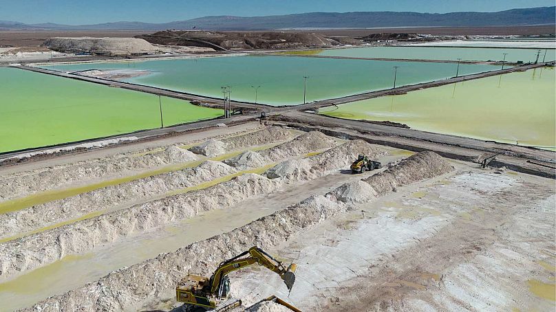Heavy equipment collects lithium carbonate and salt at the SQM Lithium company facilities near Peine, Chile, Tuesday, April 18, 2023.