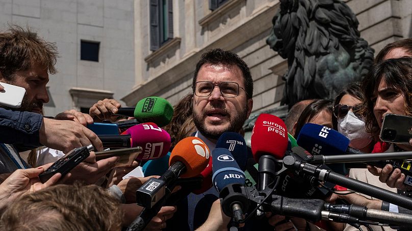 Catalan President Pere Aragones addresses the media in front of the Spanish Parliament in Madrid, Spain, Thursday, April 21, 2022.