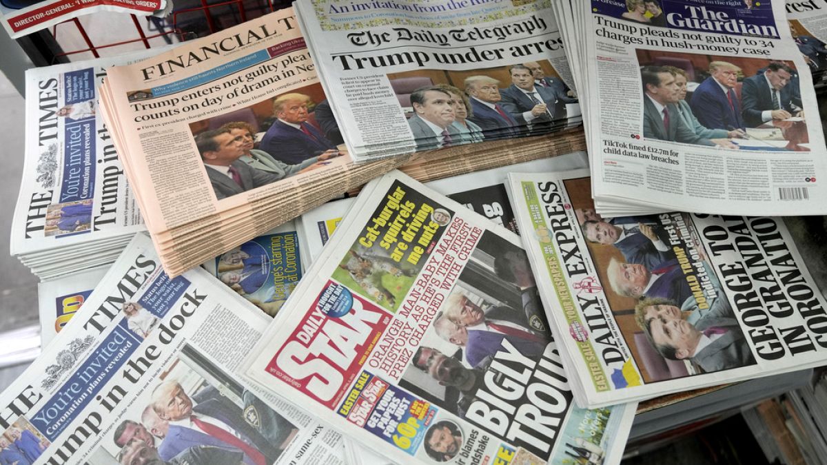 A selection of UK national newspapers displayed in a newsstand in London. April 5, 2023.