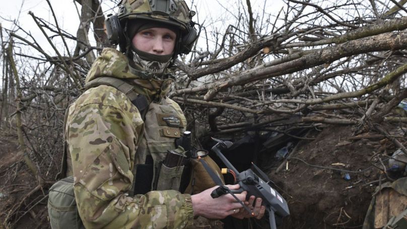 A Ukrainian soldier prepares a drone to launch on the front line in the village of Robotyne, Zaporizhzhia region, Ukraine, Friday, March 1, 2024