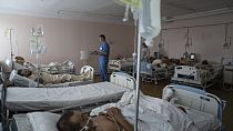 A doctor writes notes inside the ICU of Mechnikov Hospital in Dnipro, Ukraine, 15 July, 2023.