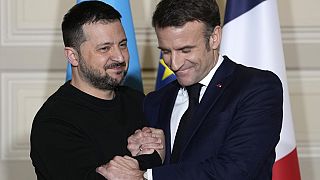  Ukrainian President Volodymyr Zelenskyy, left, and French President Emmanuel Macron shake hands after a press conference, on Feb. 16, 2024