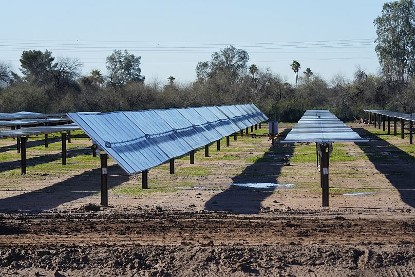 Rows of solar panels sit at Orsted's Eleven Mile Solar Center lithium-ion battery storage energy facility Thursday, Feb. 29, 2024, in Coolidge, Ariz.