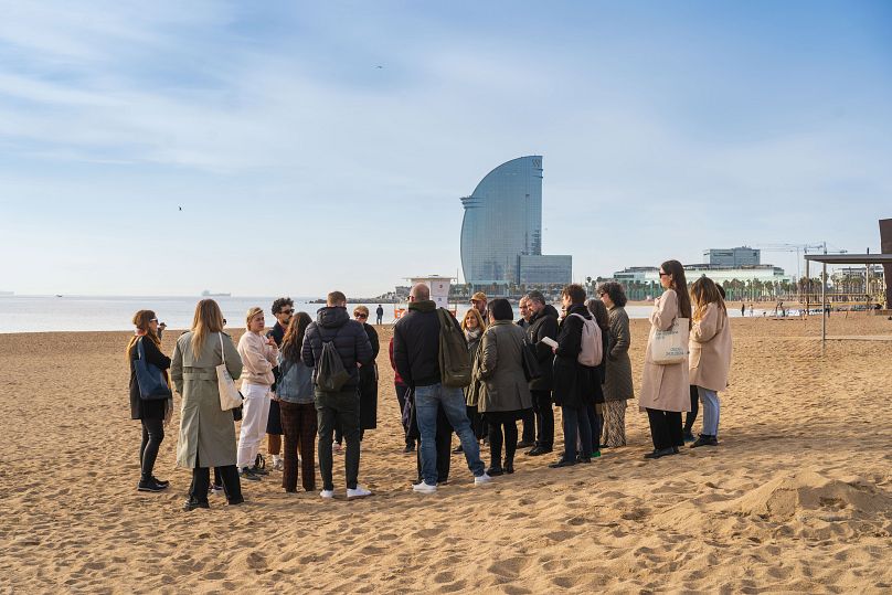 A group gathered on Barceloneta Beach