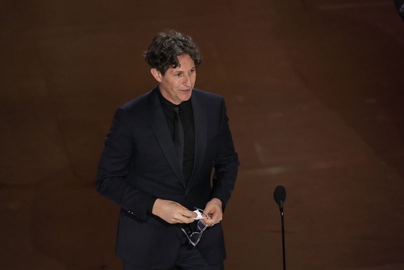 Jonathan Glazer on stage at the 96th Oscars