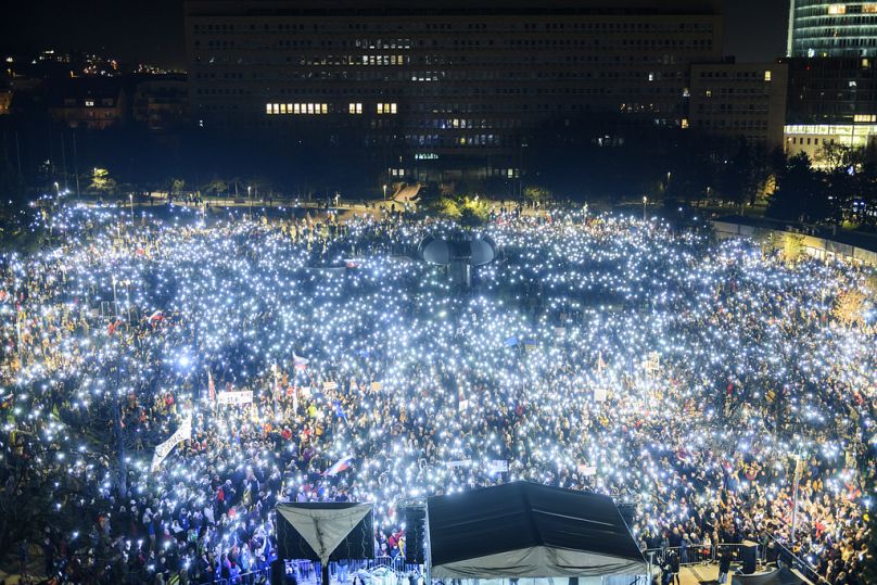 People gather to take part in a protest against the government in Bratislava