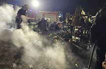 Emergency services work at the scene of a building that was damaged by a Russian drone attack in Vinnytsia, Ukraine