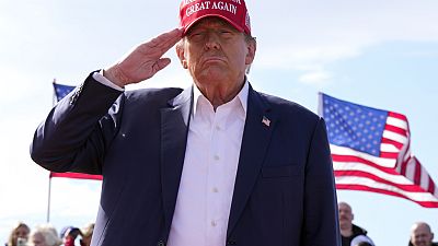  Republican presidential candidate former President Donald Trump salutes at a campaign rally 16 March, 2024, in Vandalia, Ohio.