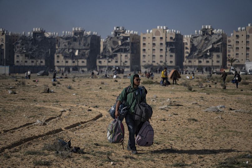 Palestinians flee from east to west of Khan Younis, Gaza Strip, during the ongoing Israeli bombardment, Saturday, Dec. 2, 2023.