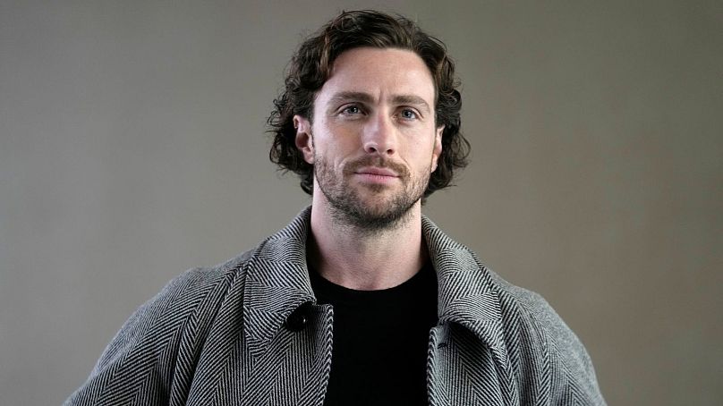 Aaron Taylor-Johnson attends the Giorgio Armani women's Fall-Winter 2024-25 collection presented in Milan - 25 February 2024