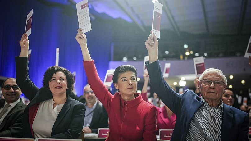 German politicians gesture during the founding conference of the new Wagenknecht party, in Berlin, Saturday, Jan. 27, 2024.