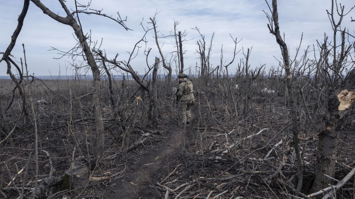 A Ukrainian soldier walks in position on the front-line near Klishchyivka, Donetsk region, Ukraine, Monday, March 18, 2024. 
