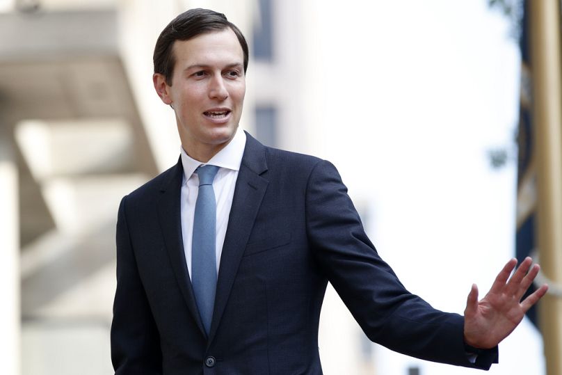 FILE - Jared Kushner waves as he arrives at the Office of the United States Trade Representative for talks on trade with Canada, Aug. 29, 2018.