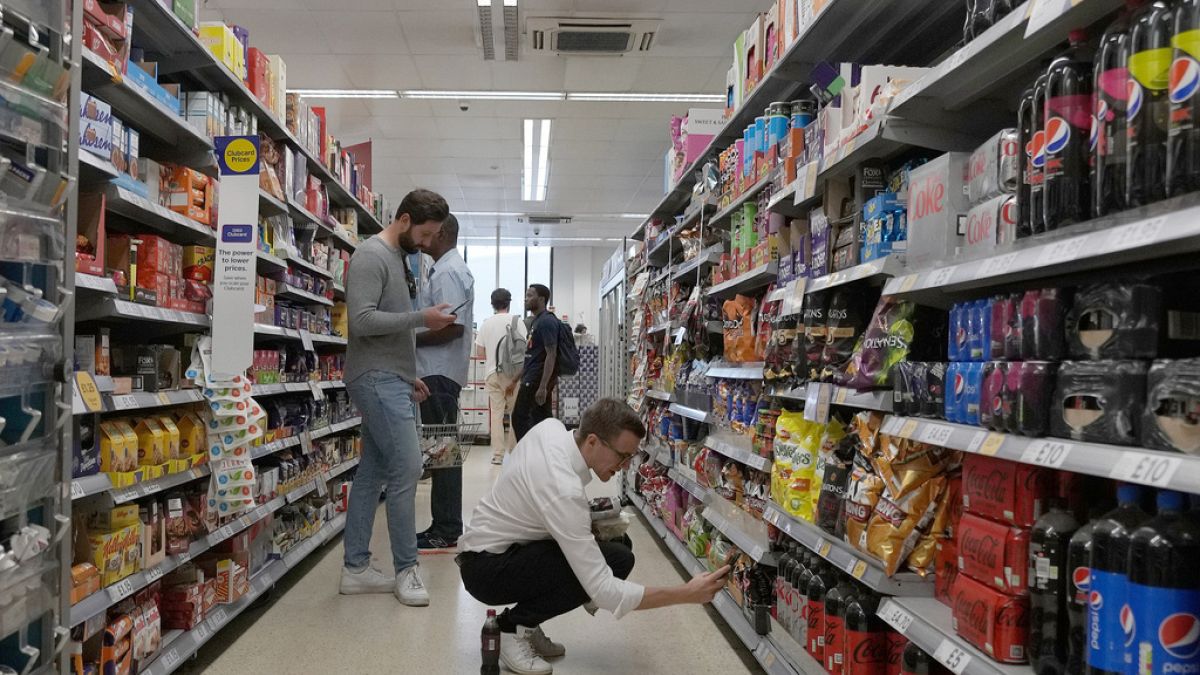 Shoppers buy food in a supermarket in London, on Aug. 17, 2022