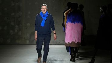 Designer Dries Van Noten accepts applause after his Fall/Winter 2024-2025 ready-to-wear collection presented Wednesday, Feb. 28, 2024 in Paris. 