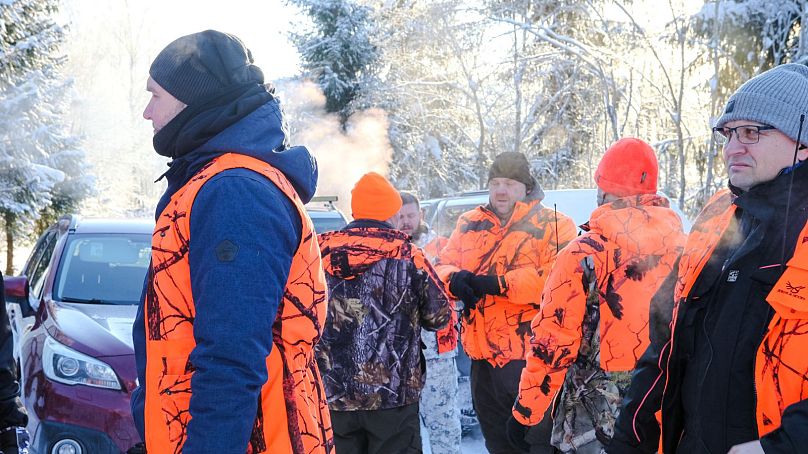Men gather at the start of a wolf hunt in Estonia this winter.