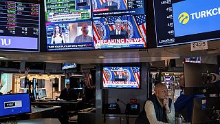Traders work on the floor of the New York Stock Exchange Wednesday, March 20, 2024, during Powell speech
