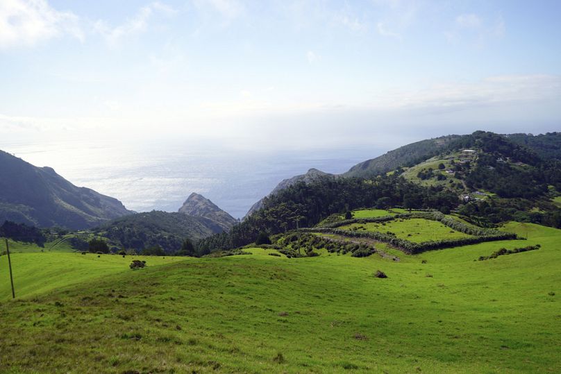 Scenic ocean views and rolling pastureland are seen on the island