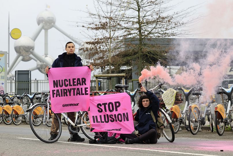 Protestors demonstrate outside the Nuclear Energy Summit in Brussels, 21 March 2024.