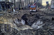In this photo provided by Serhii Popko, the head of the city's military administration, firefighters work at the site after Russian attacks in Kyiv, Ukraine, march 21