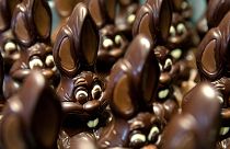 Chocolate rabbits wait to be decorated at the Cocoatree chocolate shop, April 2020, in Lonzee, Belgium.
