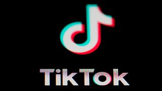 The icon for the video sharing TikTok app is seen on a smartphone.