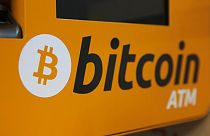 A Bitcoin logo is displayed on an ATM in Hong Kong, Thursday, Dec. 21, 2017.