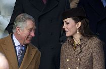 FILE - Charles chats with his daughter-in-law Kate in Sandringham, England, Thursday, Dec. 25, 2014.