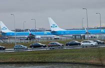 KLM airplanes sit in Schiphol Airport near Amsterdam, Netherlands.