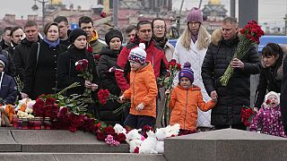 People lay flowers at a spontaneous memorial in memory of the victims of Moscow attack in St. Petersburg, Russia, Sunday, 24 March, 2024.