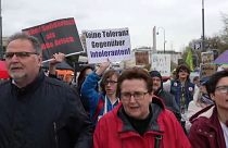 Demonstrator with sign "No tolerance towards intolerant people" at demonstration against right-wing extremism in Vienna.