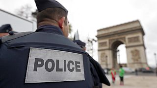 Police forces patrol near the landmark, the Arc de Triomphe, in Paris, Tuesday, Nov. 17, 2015. 