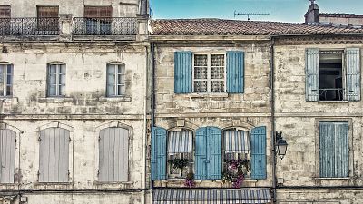 Pastel painted terraced houses in Arles, France