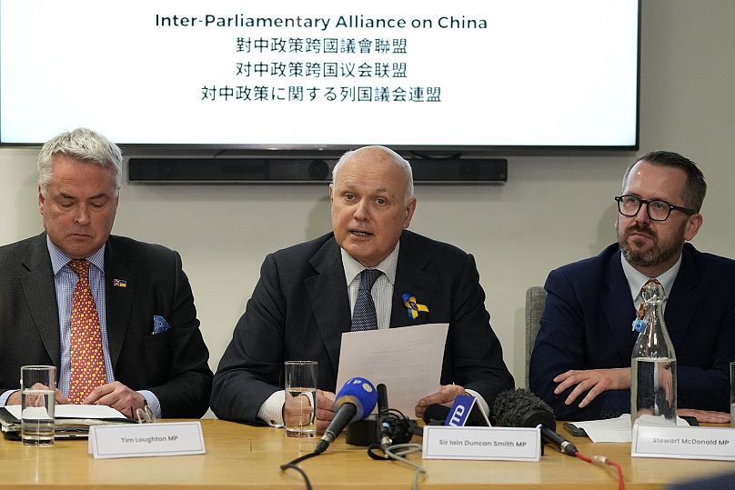 British MPs, Tim Loughton, from left, Iain Duncan Smith, and Stewart McDonald attend a press conference.