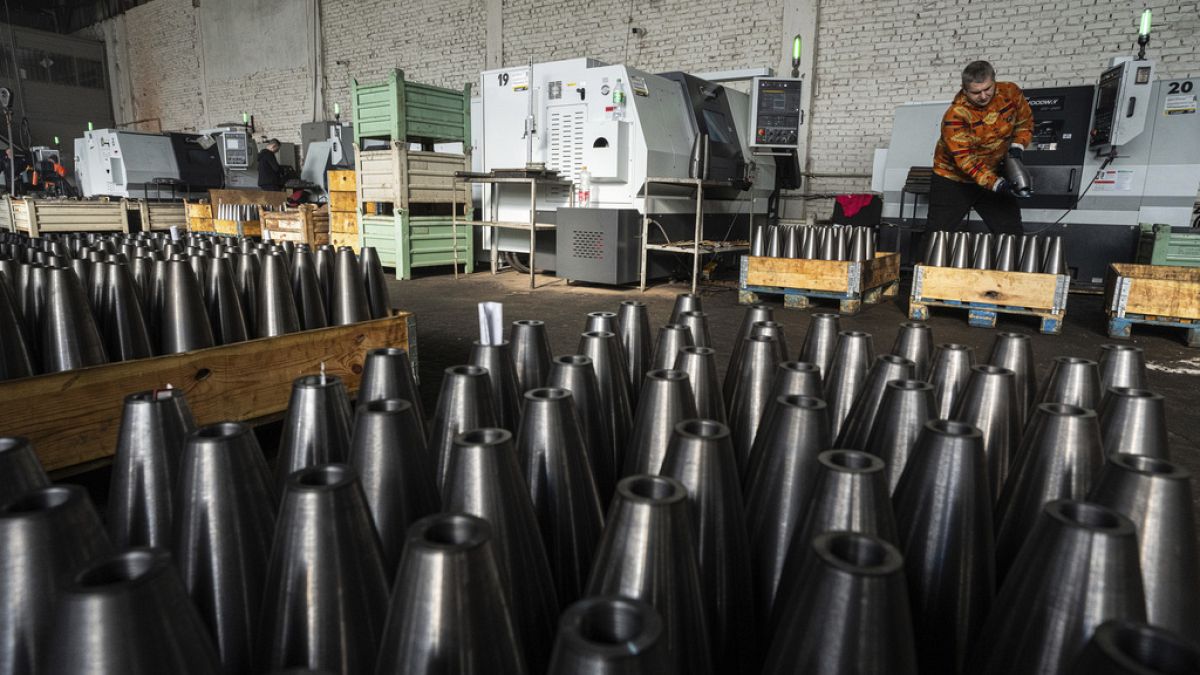 A worker stores mortar shells at a factory in Ukraine, on Wednesday, January 31, 2024.